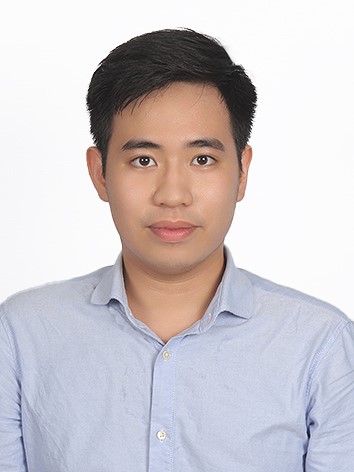 A person in a blue shirt Description automatically generated