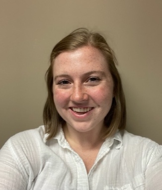 A person smiling for a selfie Description automatically generated